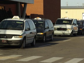 Taxis lined up at the Regina International Airport, but there's still no bus service.