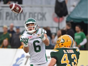 Rob Bagg, 6, of the Saskatchewan Roughriders catches a 26-yard touchdown pass from Darian Durant on Friday night against the host Edmonton Eskimos. On this play, Durant went over 25,000 in career passing yards.