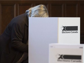 A voter casts their ballot in the 2015 federal election. A parliamentary committee is looking at alternative voting systems for future elections.