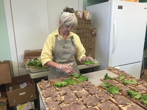 Irene Russon, an education supervisor at REACH makes sandwiches at the Heritage Community Association on Wednesday, July 13 as part of the Potash Corp REACH in the Parks and Food on the Move Summer Lunch programs that provide healthy lunches and snacks to children in Regina. ASHLEY ROBINSON