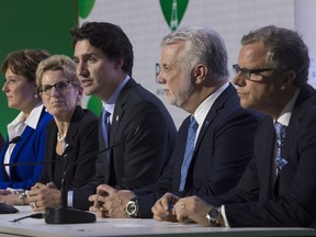 Saskatchewan Premier Brad Wall (right) with fellow premiers and Prime MInister Justin Trudeau last fall will be trying to strike an interprovincial trade deal when premiers meet later this month.