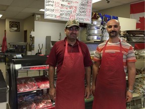 Mediterranean Market Halal Meat and Grocery co-owners Husain Hamad, left, and Safwan Zanoun, right, stand by their butcher's counter in Regina.