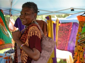Patricia Semey poses at her stall of traditional African clothing at her booth at AfroFest in Regina, Sask. on Saturday July 9, 2016. MICHAEL BELL