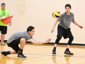 Paul Natomagan of Pinehouse prepares to bump the ball as teammate Tyrone Park, from La Loche, looks on during Saskatchewan Summer Games volleyball action on Friday in Estevan.