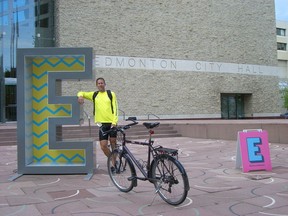 Peter Ledingham was riding his bike across Canada when the journey was stopped, at least temporarily, by the theft of his bike in Regina. Ledingham is pictured here outside Edmonton City Hall.