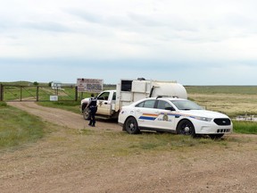 RCMP and a local Ponteix town employee at the Ponteix town dump site on Friday.