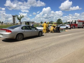 Regina police, EMS and Fire and Protective Services responded to a crash on the 900 block of Winnipeg Street over the lunch hour Friday. The driver and lone occupant of the white car was taken to hospital for "precautionary assessment." Photo by