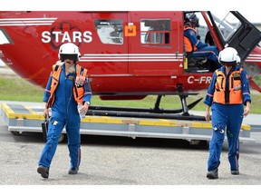 STARS flight nurse Tammy Hagerty, left, and flight paramedic, Jolene Karapita, return to the Regina base from an emergency call on Wednesday.