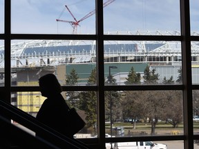 Foot traffic on the stairs at the Queensbury Convention Centre at Evraz Place has a great view of the new Mosaic Stadium under construction on the grounds.