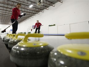 Skip Michelle Englot, left, and Ashley Howard talk during a team practice at the Highland Curling Club in Regina on Jan. 19, 2015.