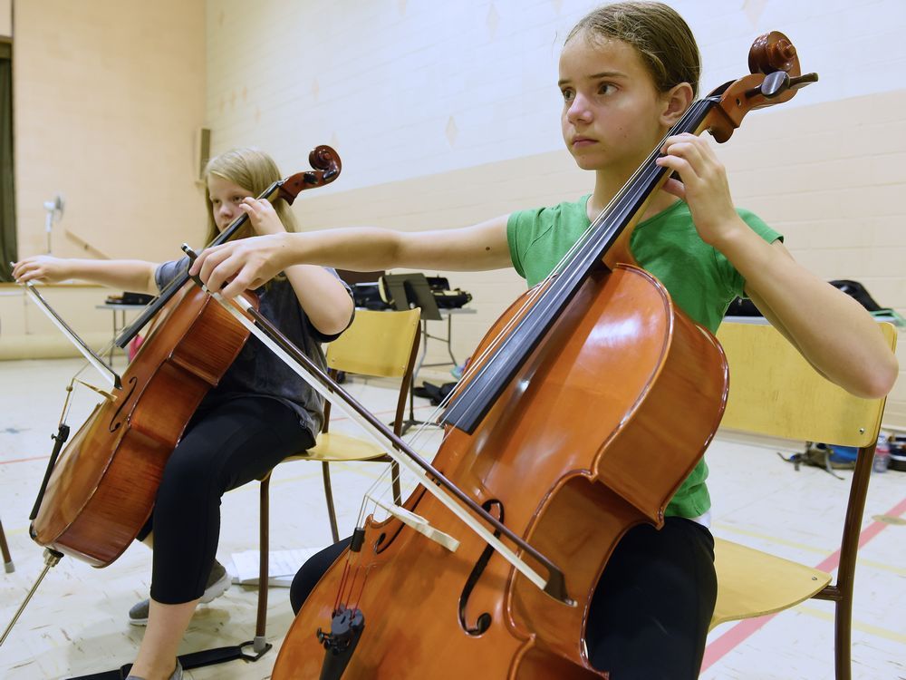Regina kids adding strings to their bows at summer camp Toronto Sun