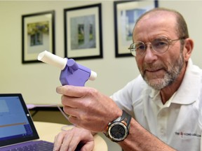 Dr. Brian Graham, the current president and CEO of the Lung Association of Saskatchewan, with a spirometer. He will be retiring at the end of the year. Graham has been the association's CEO since 1985, and is the third CEO in the association's 105-year history.