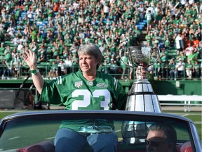 Ron Lancaster's daughter, Lana Mueller, with the Grey Cup during a halftime ceremony that paid tribute to the 1966 Saskatchewan Roughriders.