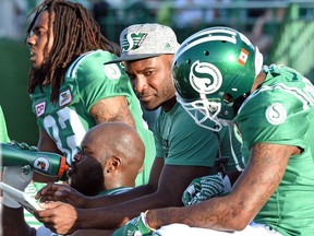 Saskatchewan Roughriders quarterback Darian Durant (in cap) was back on the bench after being injured in the game against the B.C. Lions at Mosaic Stadium on Saturday.