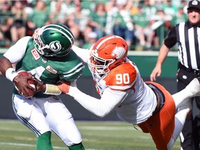 B.C. defensive tackle Mic'hael Brooks (90) was penalized but not fined for grabbing the facemask of Riders quarterback Darian Durant on Saturday.