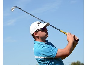 Regina's Garrett McMillan keeps an eye on his shot during Tuesday's action at the Saskatchewan PGA golf championship at the Tor Hill Golf Course.
