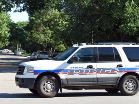 Regina police on a scene on King Street at 8th Avenue in Regina on Monday morning.