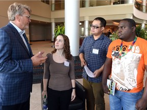 From left, Mike Monea, President Carbon Capture Inititatives at SaskPower talks with Hannah Rose Schonwald from the United States,  Shuangxing Liu from China and Rofhiwa Raselavhe from South Africa as BHP Billiton-SaskPower CCS Knowledge Centre hosts 50 graduate students from 17 counties this week.