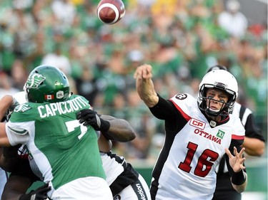 Ottawa Redblacks quarterback Brock Jensen throws during CFL action against the Saskatchewan Roughriders at Mosaic Stadium in Regina.