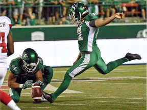 Saskatchewan Roughriders receiver Rob Bagg holds while Tyler Crapigna kicks a field goal to win the game 30-29 over the Ottawa Redblacks at Mosaic Stadium in Regina.