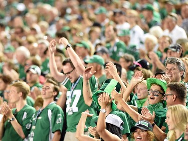 Saskatchewan Roughriders fans celebrate after the Riders won the game 30-29 over the Ottawa Redblacks at Mosaic Stadium in Regina.