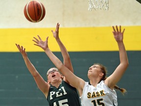 Anna Wiebe, right, of Saskatchewan and Rylee Connolly of Prince Edward Island battle for the ball during an under-15 game Wednesday at the Basketball Canada under-15 and under-17 girls championship at the University of Regina.
