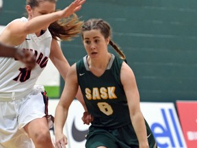 Chelsea Misskey, right, of Saskatchewan tries to drive past Bridget Mulholland of Ontario on Tuesday during under-17 action at the Basketball Canada under-15 and under-17 girls championships at the University of Regina.