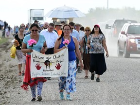 Lisa Bigeagle (L) and Janine Windolph (R) lead the memorial walk from the Saulteaux Junction corner of Pinky Road and Dewdney Avenue to the Regina Indian Industrial School Cemetery north on Pinky Road. DON HEALY / Regina Leader-Post