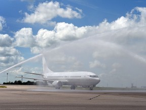 Fire tenders perform a water cannon salute marking the first NewLeaf flight into Regina.