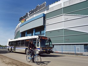 A City of Regina transit bus on Elphinstone Street passing by the new Mosaic Stadium.