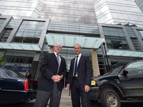 Michael Hoffort (R), CEO of Farm Credit Canada, the main tenant of Agriculture Place at 1820 Hamilton Street. and Paul Hill,  CEO of The Hill Companies, at the official opening of the building in late May. The completion of the 11-storey, 160,000 square foot building has helped increase the vacancy rate to 15 per cent in the downtown.