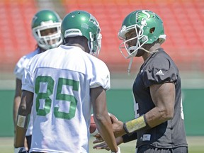 Saskatchewan Roughriders quarterback Darian Durant, right, speaks with receiver Ryan Lankford, 85, during Monday's practice at Mosaic Stadium.