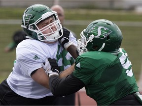 Aaron Picton (left), shown here during training camp in Saskatoon, has returned to the Saskatchewan Roughriders.
