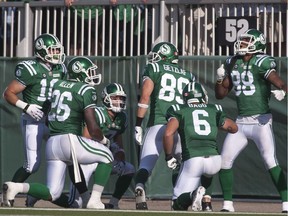 Saskatchewan Roughriders wide receiver Taj Smith, right, celebrates a key touchdown with his teammates on Aug. 31, 2014. Since defeating the Winnipeg Blue Bombers 35-30 in the 2014 Labour Day Classic, the Roughriders have consistently dealt with misfortune.