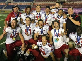 The Saskatchewan-born players and coaches on Team Canada celebrate a gold-medal victory over the United States at the International Federation of American Football under-19 world championship in Harbin, China, on Sunday.
