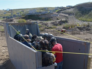 Allied troops gather in a landing craft and prepare to rush the field at an annual Second World War paintball re-enactment of the battle for Juno Beach at Prairie Storm Paintball near Moose Jaw, Sask. on Saturday Aug. 27, 2016.