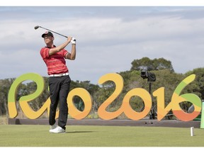 Canada's Graham DeLaet tees off on the 16th hole in the first round at the 2016 Summer Olympics in Rio de Janeiro, Brazil, Thursday, Aug. 11, 2016.