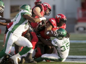 Calgary Stampeders running back Jerome Messam was a handful for Greg Jones, 35, and the Saskatchewan Roughriders' defence on Thursday.