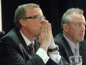 Saskatchewan Premier Brad Wall, left, and now former cabinet minister Don McMorris.