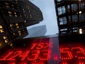 A tote board displays the closing figure for the TSX on Dec.31, 2012.