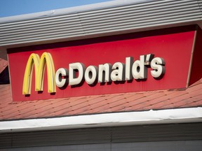 (FILES) This file photo taken on January 5, 2016 shows a McDonald's fast food restaurant location in Woodbridge, Virginia. McDonald's' "All-Day Breakfast" fueled firm sales gains in the second quarter despite weak growth across the fast food industry, the company reported July 26, 2016.But net earnings continued to suffer from the costs of selling off company-owned restaurants to franchisees in a multi-year strategy to trim overhead costs.  /