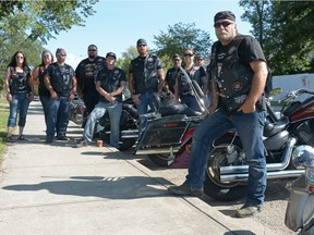 Freedom, right, stands with other members of Bikers Against Child Abuse at Seven Stones Community School in Regina, Sask. on Saturday Aug. 6, 2016. The national organization supports and protects children and families who are victims of abuse. BACA's Regina chapter hosted a kids day and ride fundraiser.