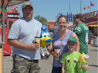 Greg and Miranda Stadnyk with Alexis Masch at Queen City Ex in Regina, Sask. on Saturday Aug. 6, 2016.