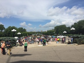 A protest outside of the Saskatchewan Legislative building over the province's plans to reduce funding for more than 2,000 social assistance recipients.