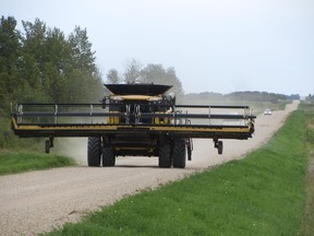 Combine on the move near Lake Lenore in late August. Saskatchewan farmers are forecast to harvest 33.6 million tonnes of grains, oilseeds and pulses, the second- largest crop ever, Statistics Canada said in its latest crop production survey.