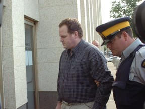 Pedophile Peter Whitmore enters Court of Queen's Bench in Regina under RCMP escort in July 2007.