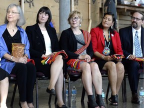 From left, Commissioners Marion Buller, Qajaq Robinson, Marilyn Poitras, Michele Audette and Brian Eyolfson listen during the announcement of the inquiry into Murdered and Missing Indigenous Women on Aug. 3.