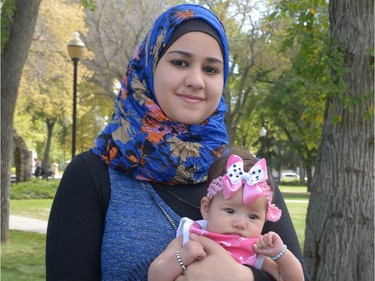 Mina Mohammed holding her baby Basmala at I Love Regina Day held at Victoria Park in Regina, Sask. on Saturday Aug. 27, 2016.
