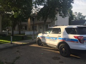 A single police cruiser sat in the alley near a taped-off duplex on the 700 block of Retallack Street on Thursday morning.