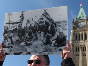 A delegation of Sayisi Dene from Northern Manitoba vigil in front of Parliament Hill in 2011. In 1956 the Sayisi Dene were forcibly relocated from their traditional lands at Little Duck Lake in Northern Manitoba to Churchill. The federal government recently apologized.